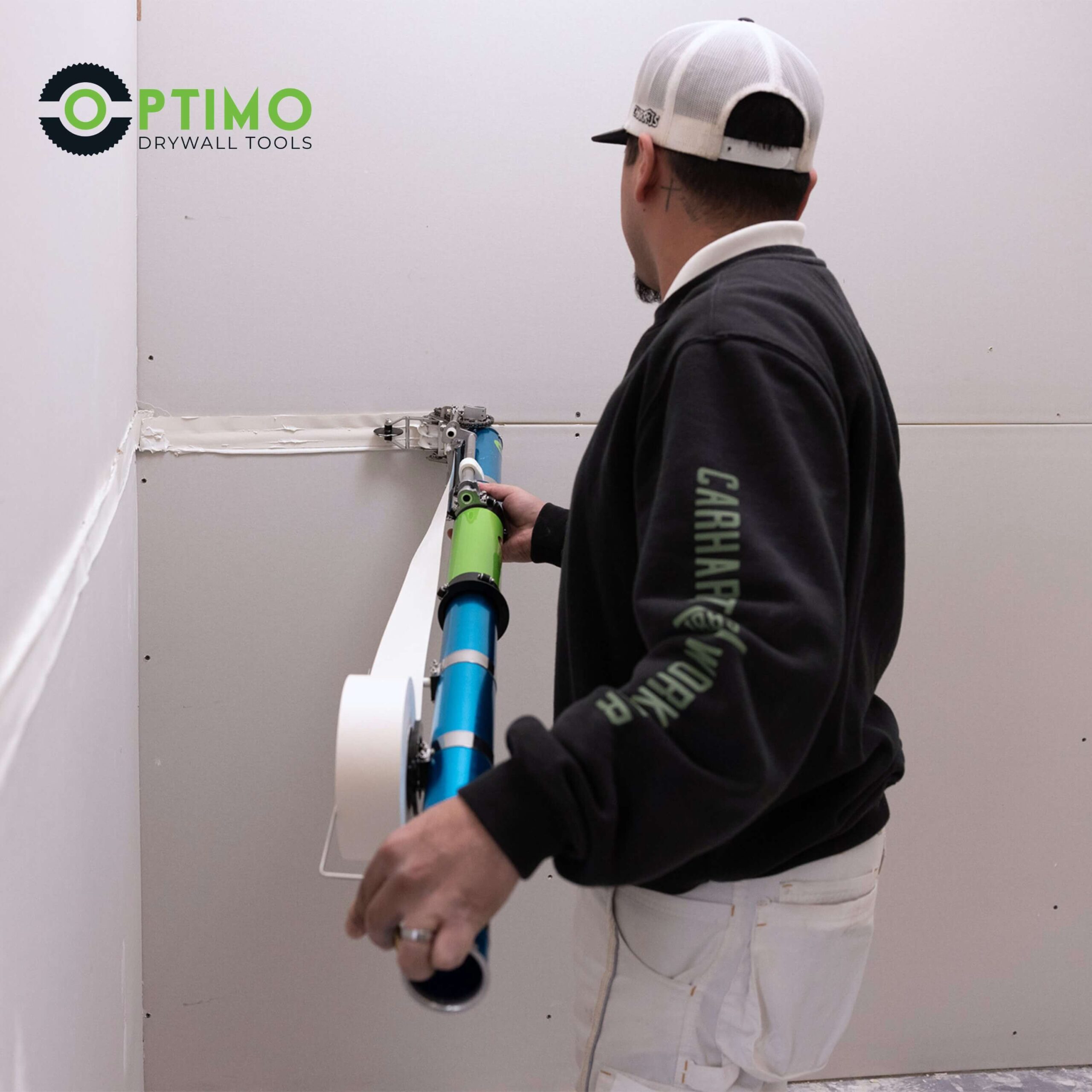 man using Optimo Drywall automatic taper