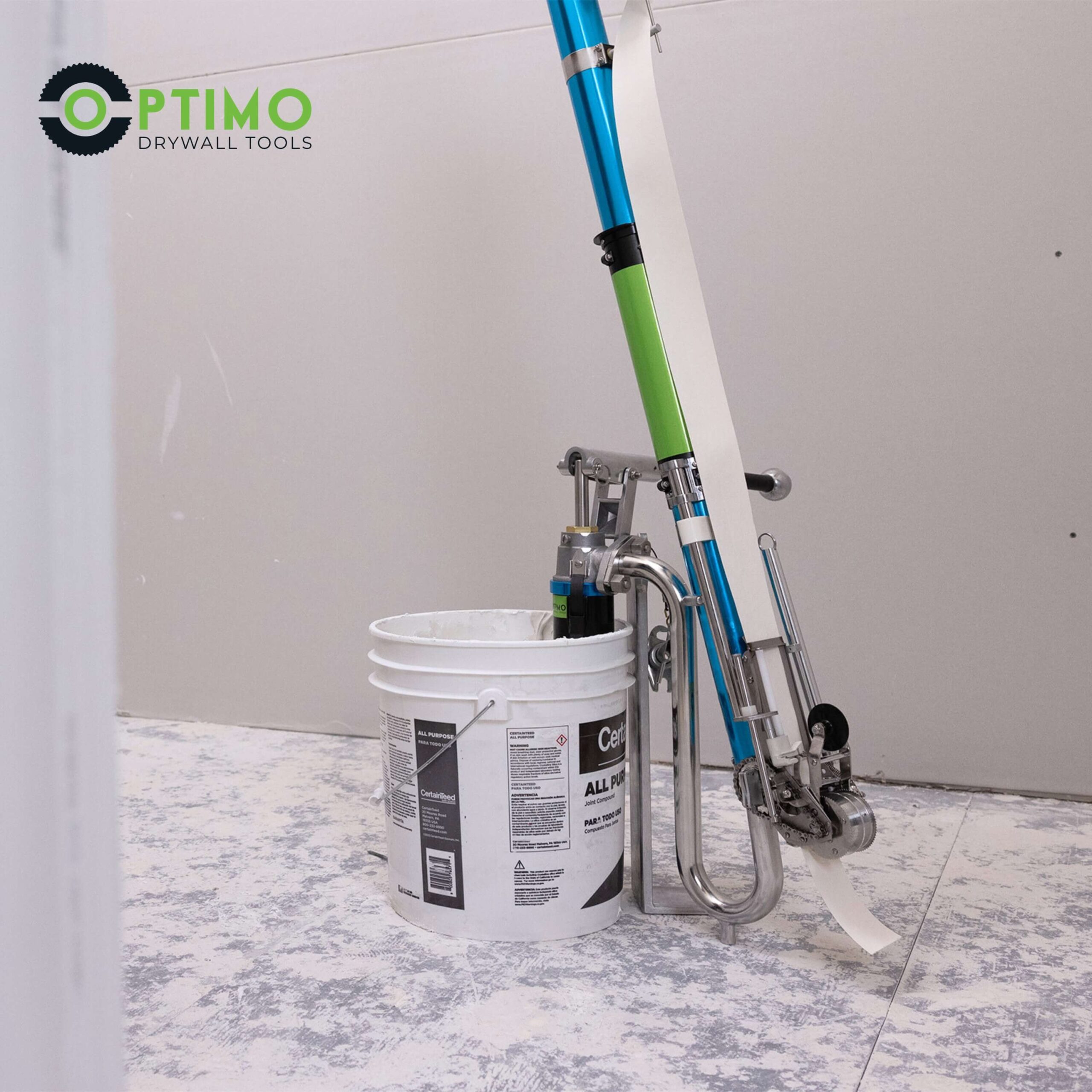 Optimo drywall loading pump by bucket of drywall mud