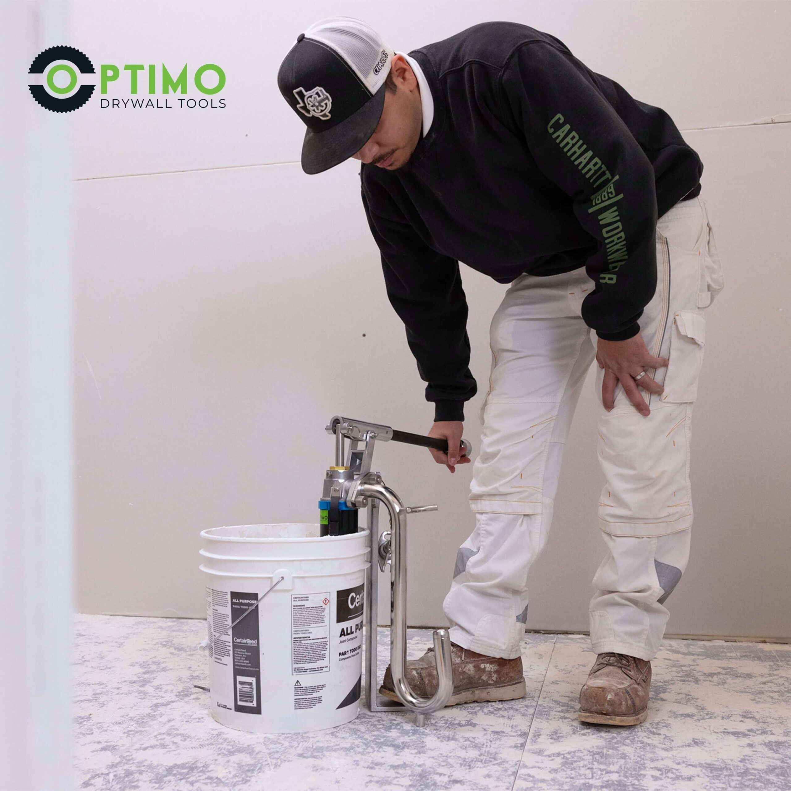 contractor using the Optimo drywall loading pump