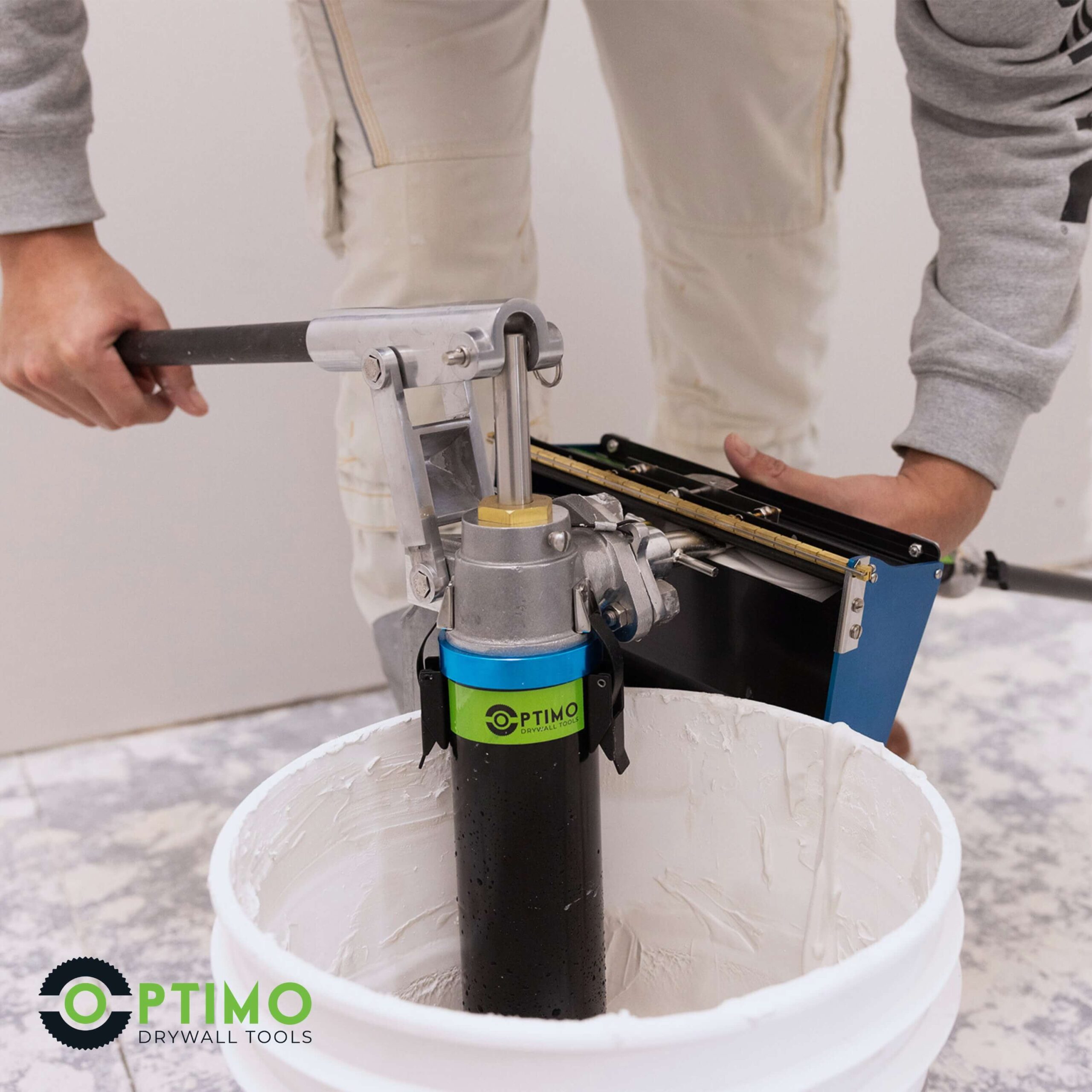 contractor using Optimo drywall loading pump